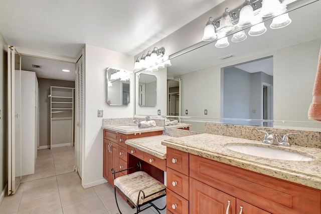 bathroom with tile patterned flooring and vanity