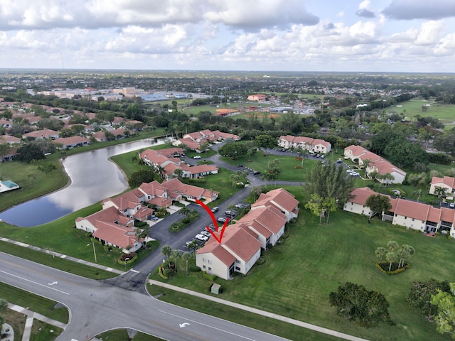 drone / aerial view with a water view