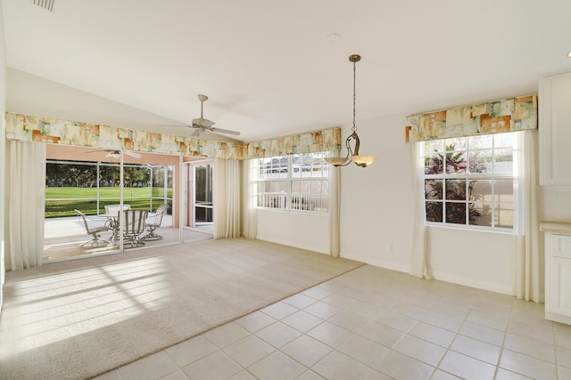 interior space with light carpet, vaulted ceiling, and ceiling fan