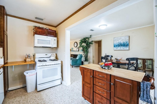 kitchen with wood counters, white appliances, crown molding, and a brick fireplace