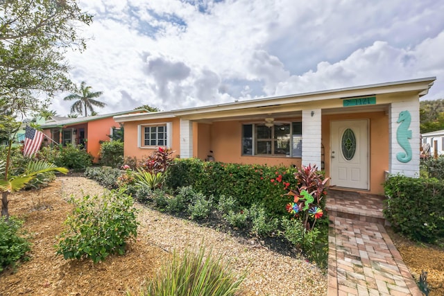 single story home featuring covered porch