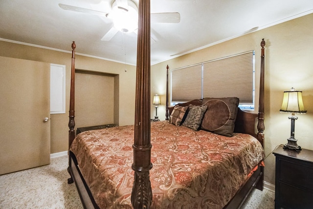 carpeted bedroom with ceiling fan and crown molding