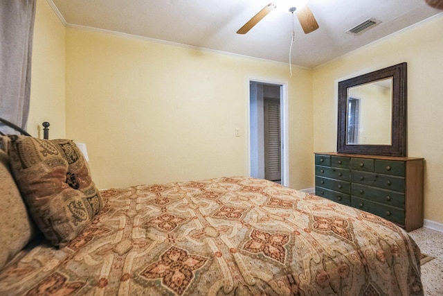 carpeted bedroom featuring ceiling fan and crown molding