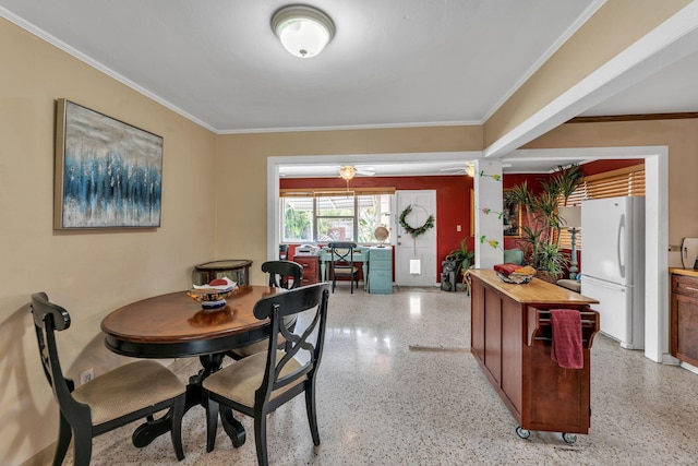 dining room featuring ceiling fan and crown molding