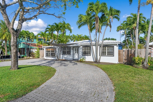 ranch-style home with a front yard