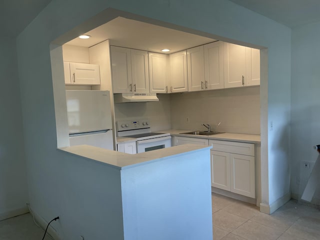 kitchen with sink, fridge, white cabinets, and white range with electric stovetop