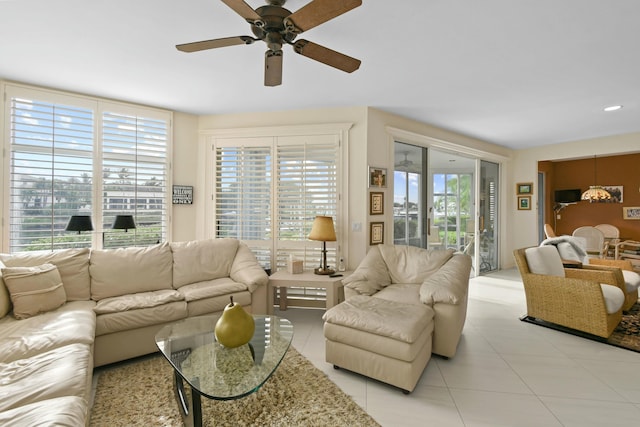 tiled living room with ceiling fan