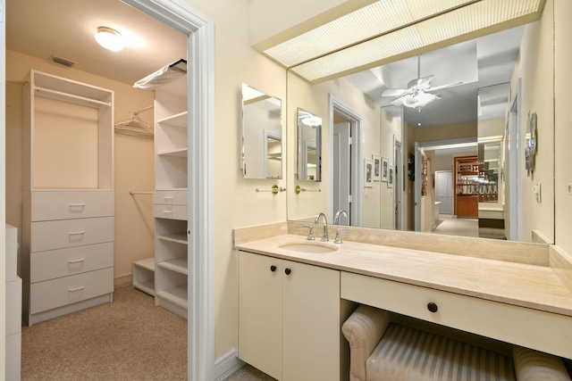 bathroom featuring vanity and ceiling fan