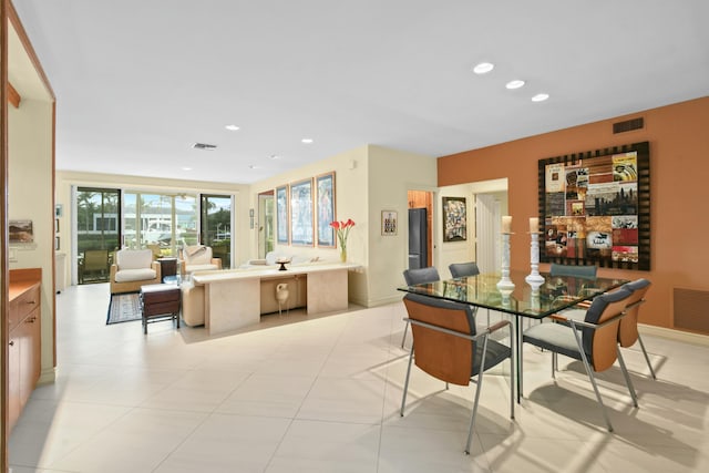 dining area with light tile patterned floors