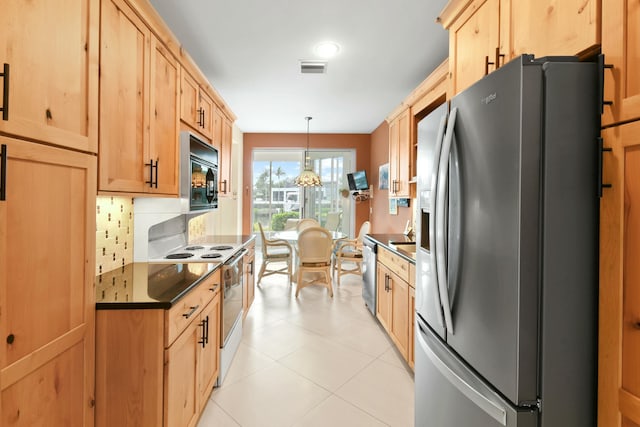 kitchen featuring light brown cabinets, tasteful backsplash, pendant lighting, light tile patterned floors, and appliances with stainless steel finishes