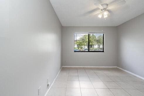 spare room with ceiling fan