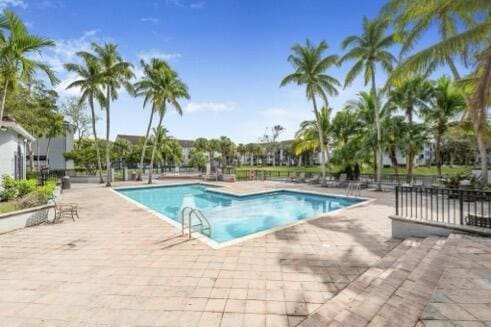 view of swimming pool with a patio area