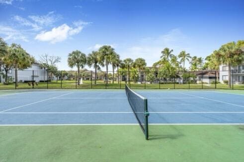 view of sport court featuring basketball hoop