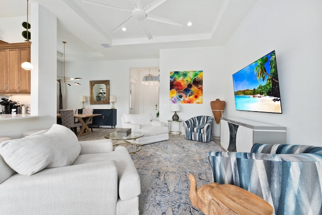 9289 SW Miracoli Way, Port Saint Lucie, FL 34987 - living area featuring a ceiling fan, a tray ceiling, and recessed lighting