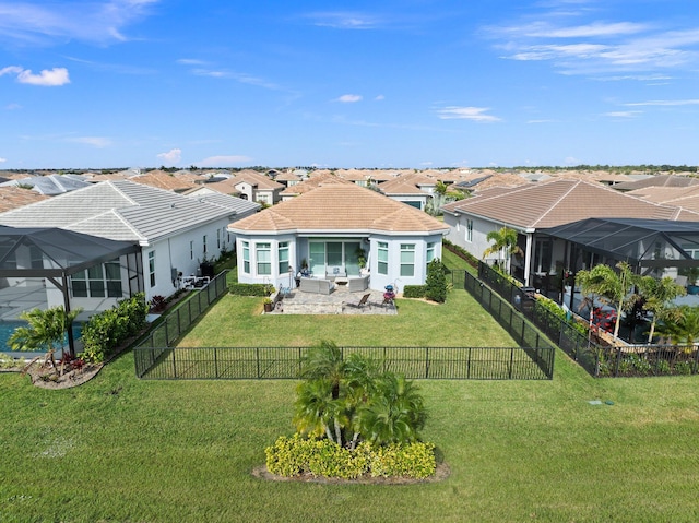 9289 SW Miracoli Way, Port Saint Lucie, FL 34987 - back of property featuring a residential view, stucco siding, a tile roof, and a patio area