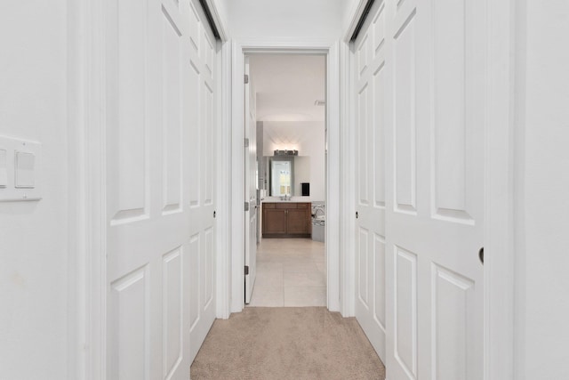 9289 SW Miracoli Way, Port Saint Lucie, FL 34987 - hallway with light carpet and light tile patterned floors