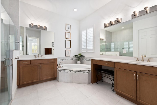 bathroom featuring tile patterned floors, vanity, and plus walk in shower