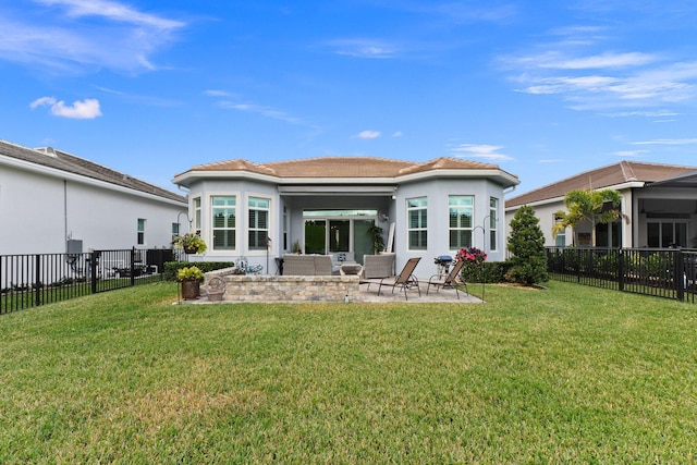 back of property with an outdoor living space, a yard, and a patio