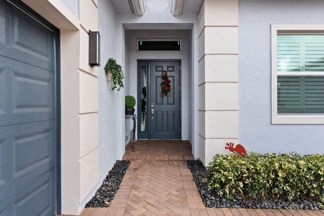 9289 SW Miracoli Way, Port Saint Lucie, FL 34987 - entrance to property featuring stucco siding
