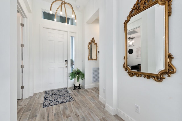 9289 SW Miracoli Way, Port Saint Lucie, FL 34987 - foyer entrance with light wood-type flooring and baseboards