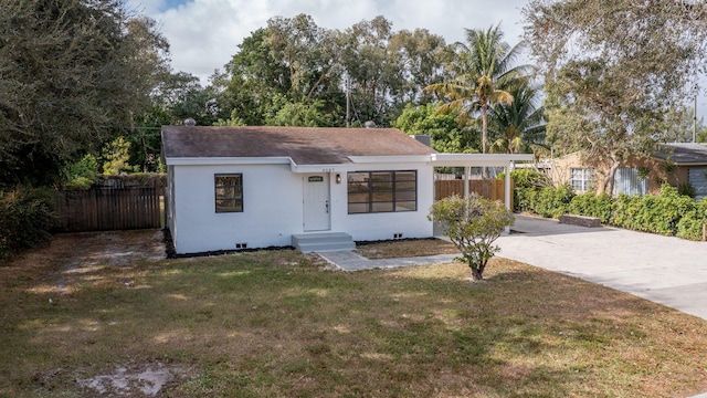 ranch-style house with a front lawn