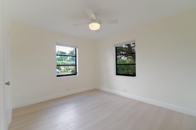 unfurnished room featuring ceiling fan and light hardwood / wood-style flooring