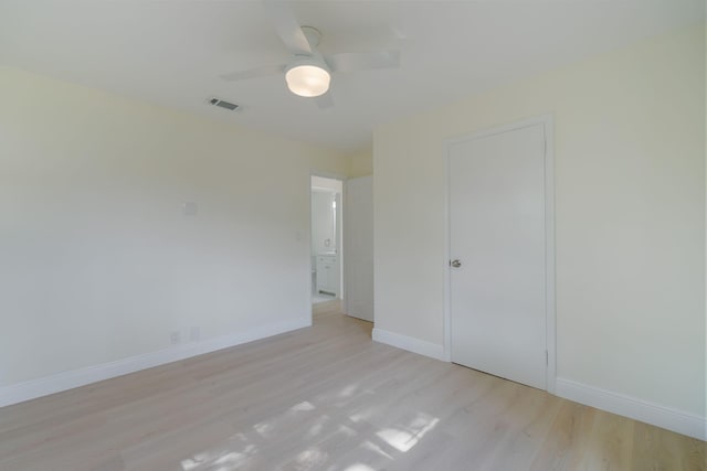 unfurnished bedroom with ceiling fan, a closet, and light hardwood / wood-style flooring