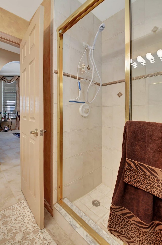 bathroom with a shower with shower door