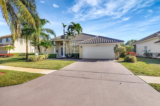 mediterranean / spanish-style house featuring a front yard and a garage