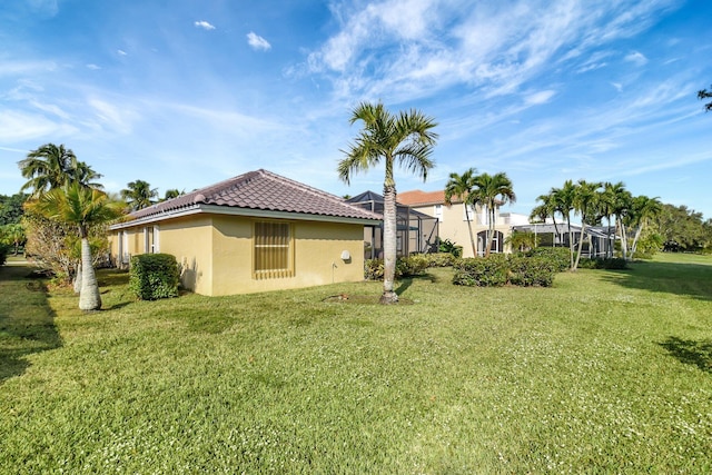 view of yard with a lanai