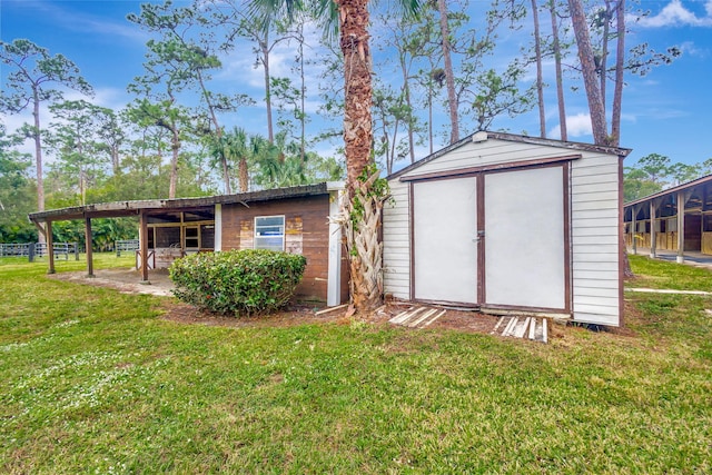 view of outbuilding featuring a yard