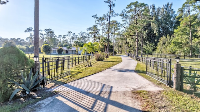 surrounding community featuring a rural view and a yard