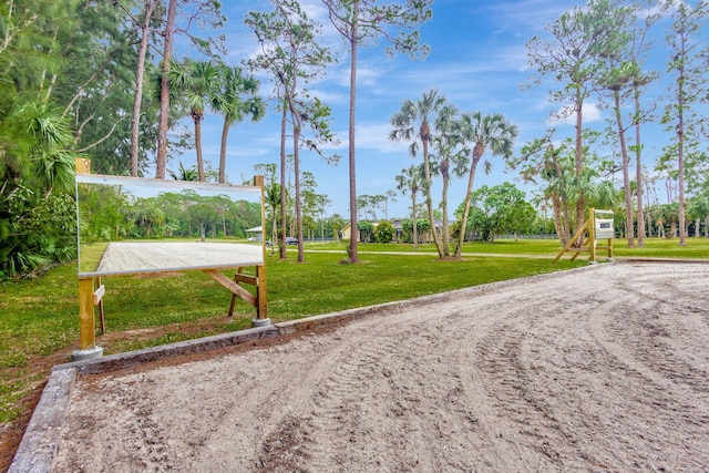 view of home's community featuring a yard