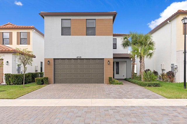 view of front of property with a garage