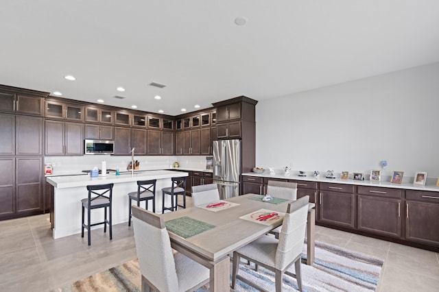 dining space with light tile patterned floors