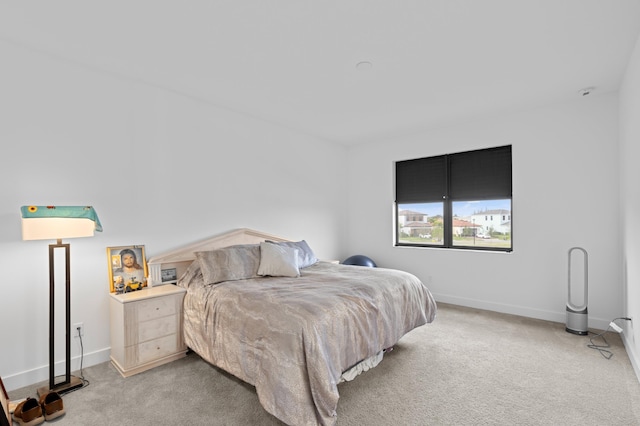 bedroom featuring light carpet