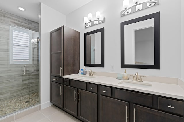 bathroom featuring tile patterned floors, vanity, and walk in shower