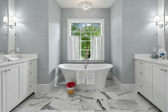 bathroom with vanity and a washtub