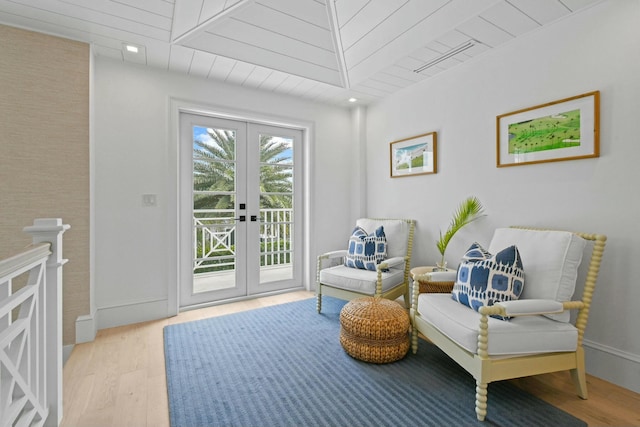 living area featuring wooden ceiling, light wood-type flooring, and french doors