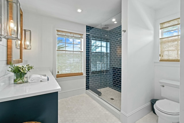 bathroom with vanity, toilet, an enclosed shower, and tile patterned flooring