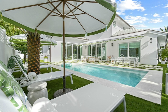 view of swimming pool with a patio area