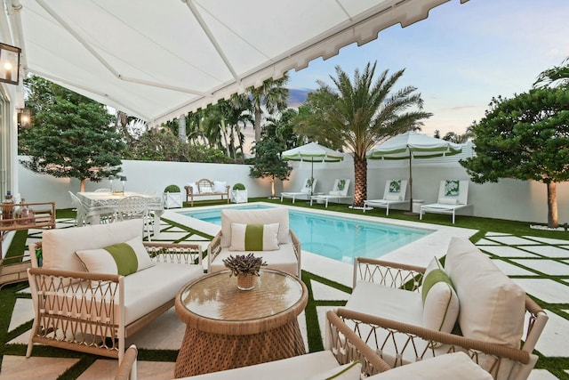 view of pool with an outdoor living space