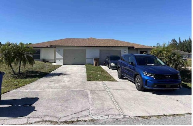 single story home featuring a garage