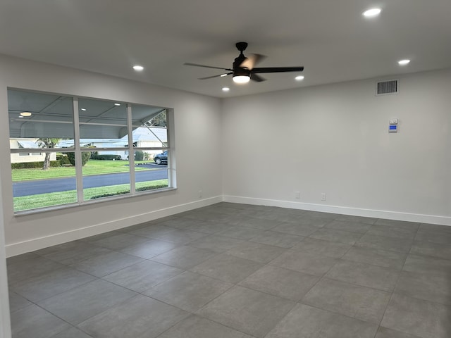 spare room with ceiling fan