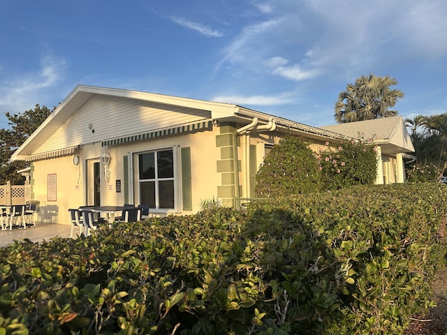 view of home's exterior featuring a patio area