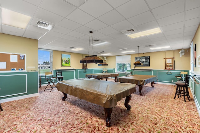 game room featuring a paneled ceiling, a wealth of natural light, light carpet, and billiards