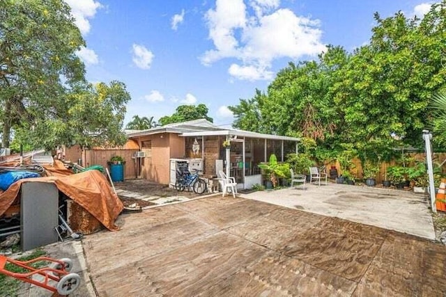 view of patio / terrace with a sunroom