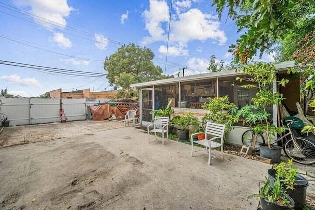 view of patio / terrace with a sunroom