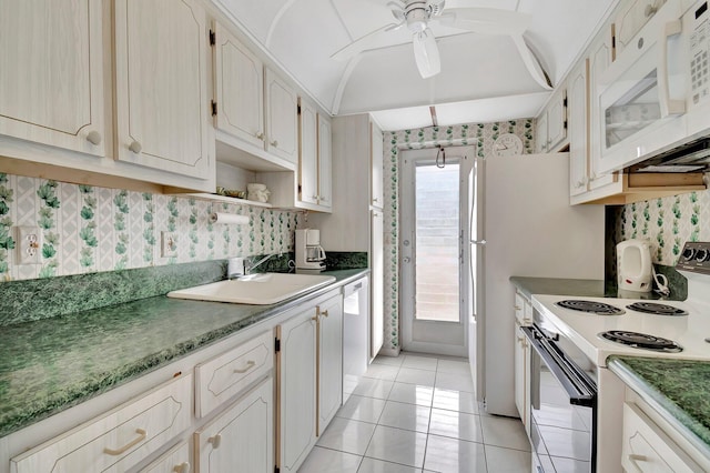 kitchen with ceiling fan, sink, light tile patterned floors, and white appliances