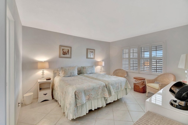 bedroom with light tile patterned floors